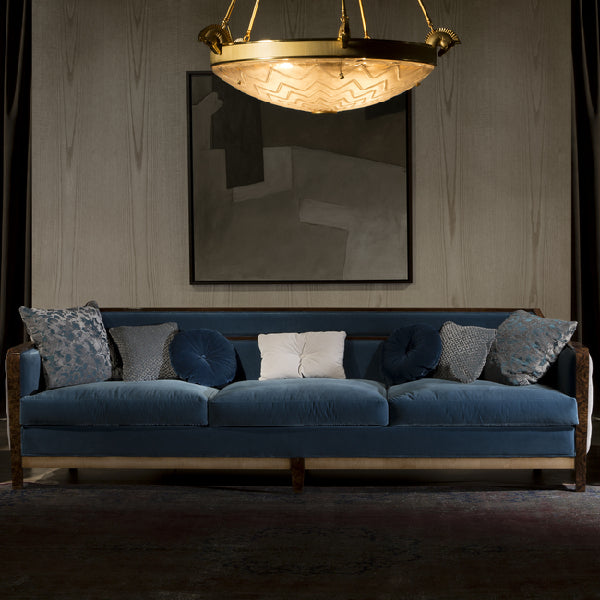 Luxurious Blue Sofa with Artistic Accents