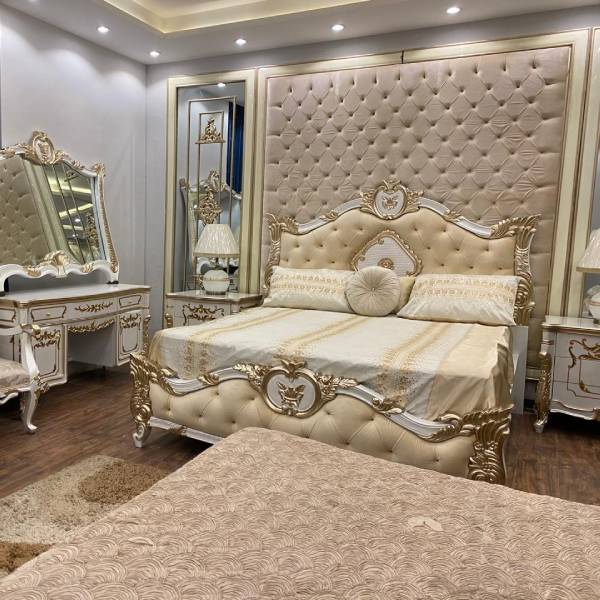 White and Gold Bedroom Set with Upholstered Headboard, Mirrored Accents, Lamps, and Chairs