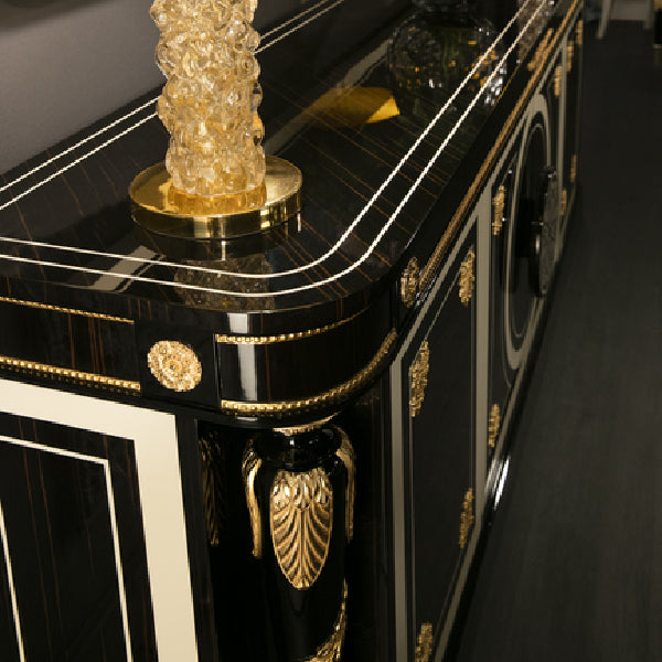 Elegant Black and Gold Sideboard with Intricate Detailing