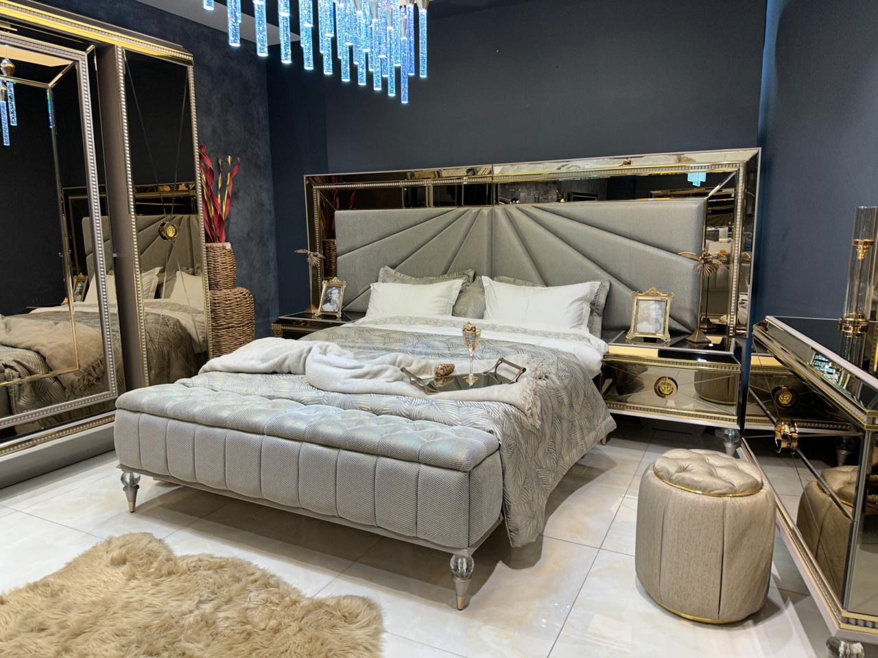 Luxury Silver Bedroom Suite with Mirrored Accents and Modern Chandelier