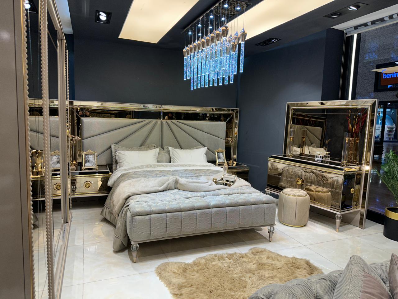 Luxury Silver Bedroom Suite with Mirrored Accents and Modern Chandelier