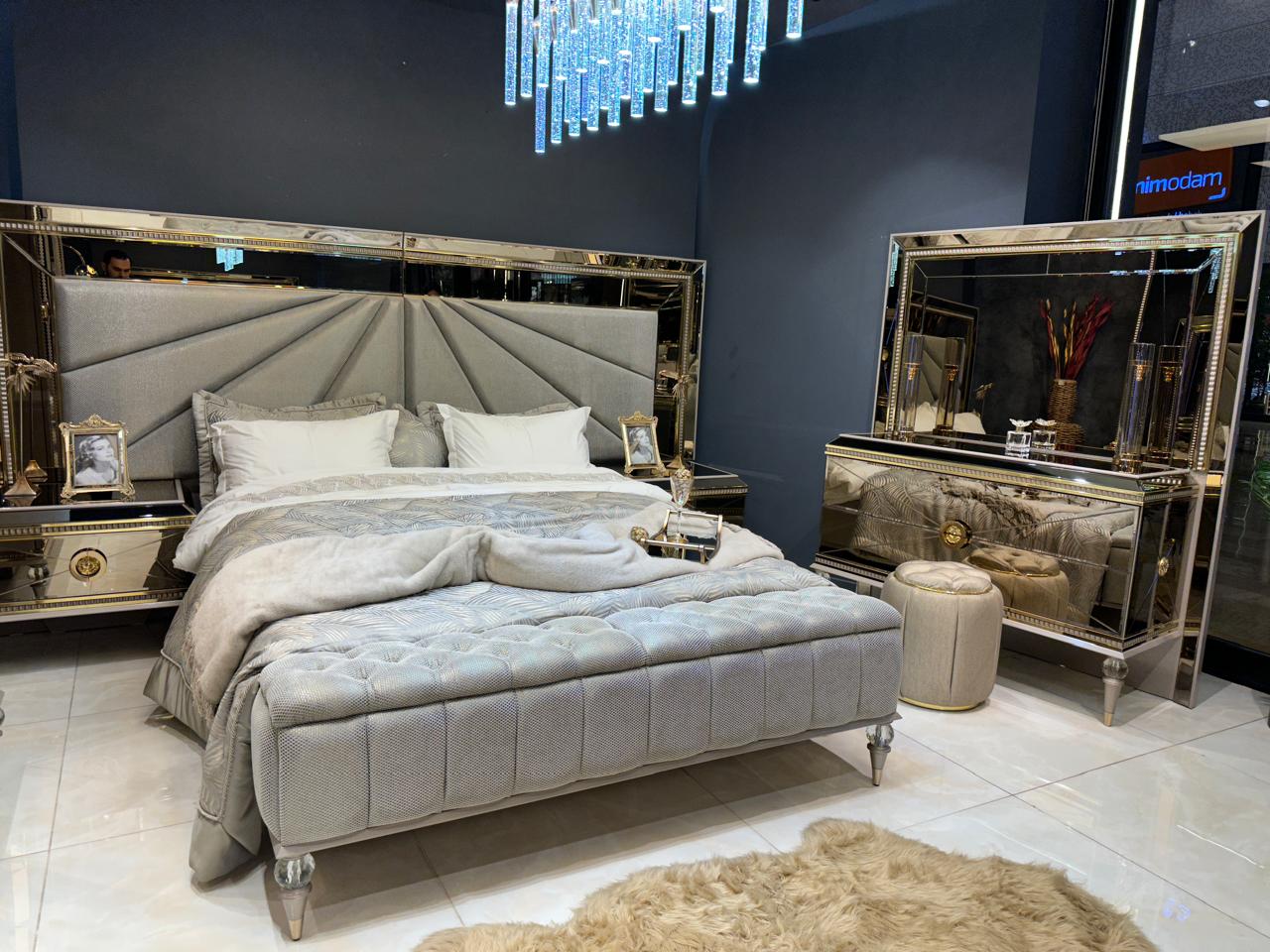 Luxury Silver Bedroom Suite with Mirrored Accents and Modern Chandelier